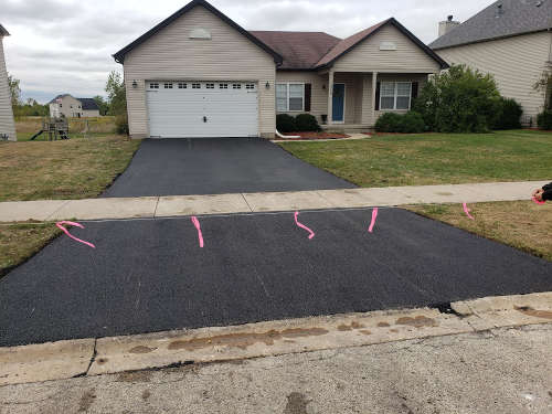 Driveway which was just paved with asphalt in Aurora IL