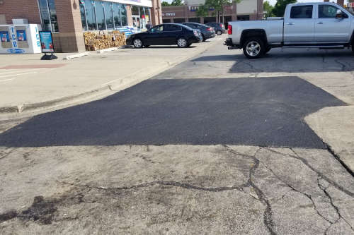 Parking lot with an asphalt patch