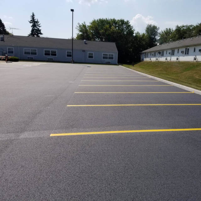 Installation of asphalt parking lot.